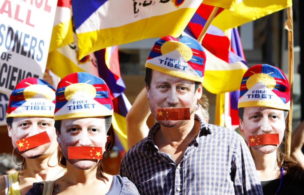 Protestors symbolise David Cameron