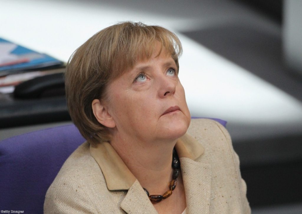 Angela Markel looks skywards as the Bundestag debates the motion this morning