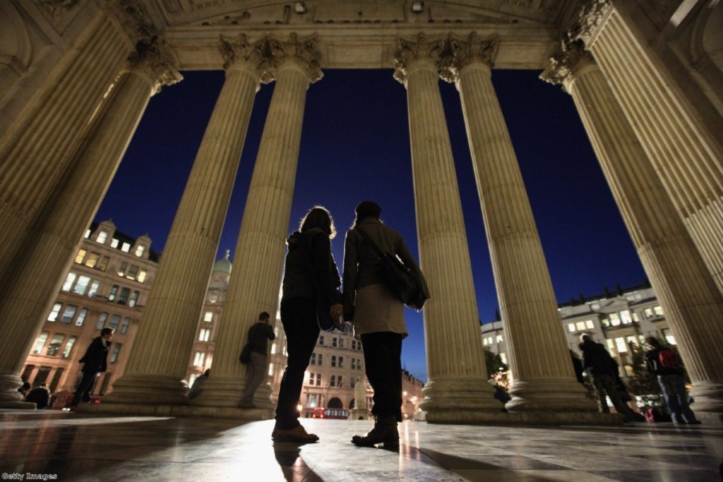 Two women stand outside St Paul's during the first Occupy protest.