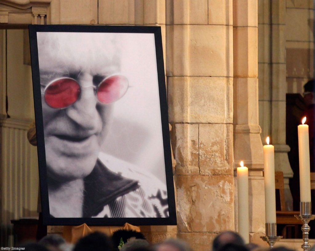 Mourners at Savile's funeral. Since the story broke, his grave has been destroyed at the family's wishes.