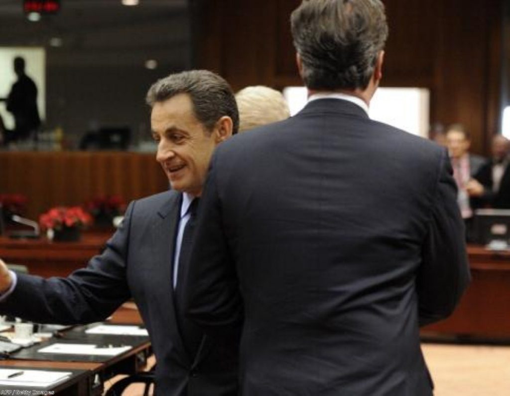 Nicolas Sarkozy and David Cameron cross each other in Brussels 