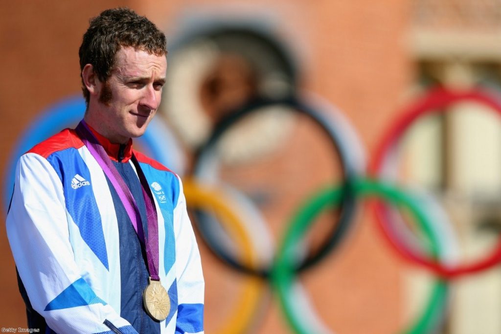  Gold medallist Bradley Wiggins celebrates during the victory ceremony 