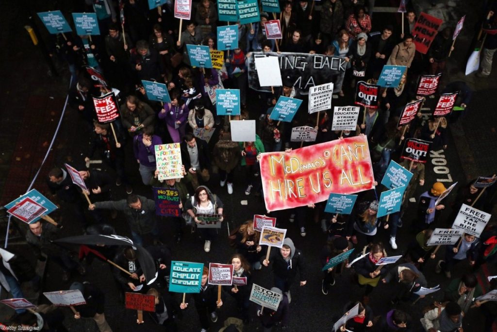 Student protestors during a wet day in London