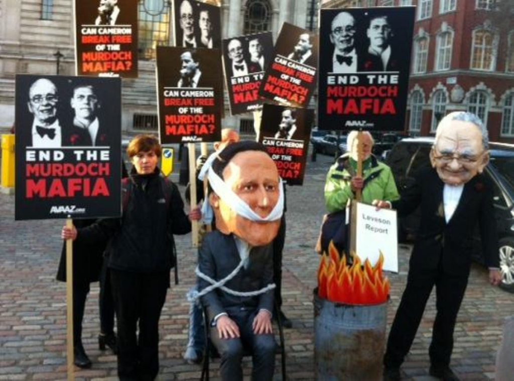 Protesters outside the QE2 Centre on Thursday, where Leveson launched his report. Cameron opposes it