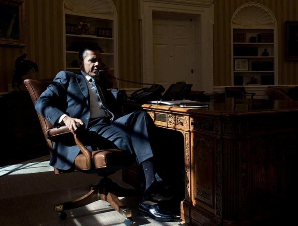 Morning winter sunlight floods the White House as Barack Obama talks on the phone with British prime minister David Cameron