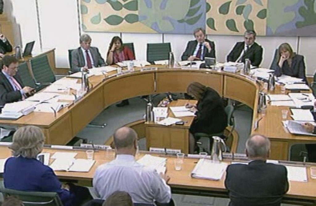 David Nicholson (centre) answers questions in Westminster this morning