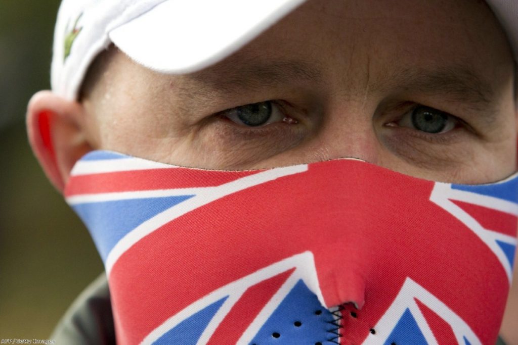 An EDL supporter looks on during a protest. Anti-fascists are worried the group could grow in coming days 