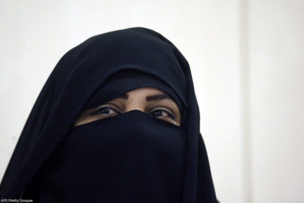 A candidate stands for election in Kuwait wearing the niqab. in Europe, the full-face veil has been a constant source of controversy. 