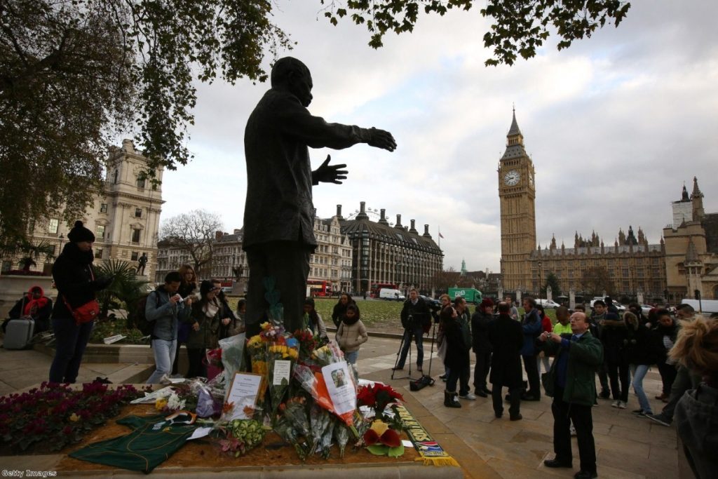 Crowds gather at Mandela's status in Parliament Square