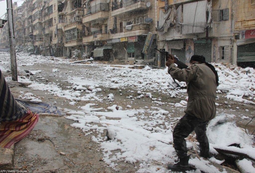 A rebel fighter aims his weapon during clashes with pro-government forces in Aleppo last Wednesday