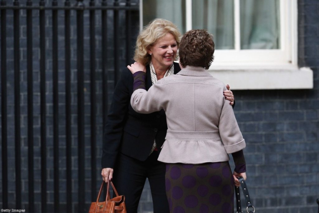 Soubry congratulates a colleague as she arrives at Downing Street during the 2013 reshuffle  