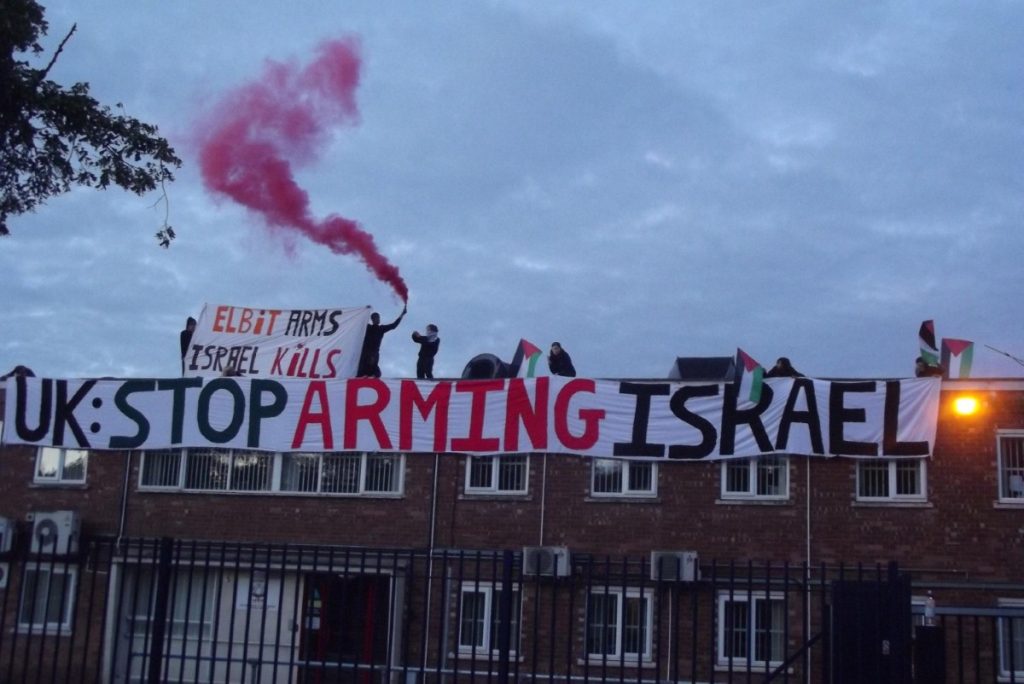 Pro-Palestinian activists on the roof of the factory this morning 