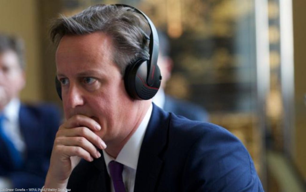 David Cameron listening to some big tunes. Or, maybe, a translator.