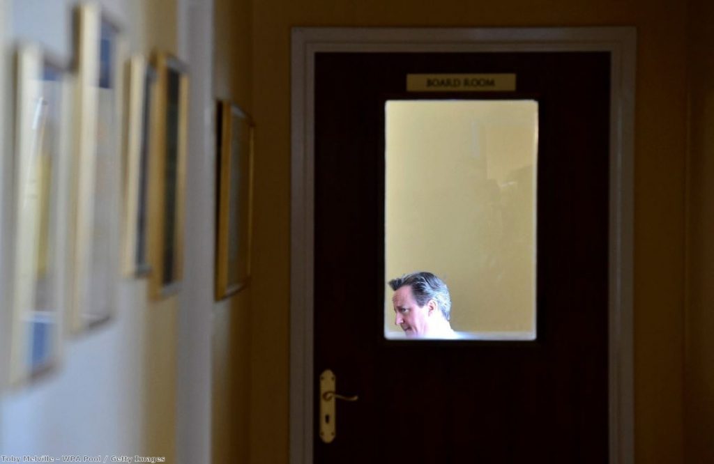 David Cameron prepares to speak at an election event on the campaign trail