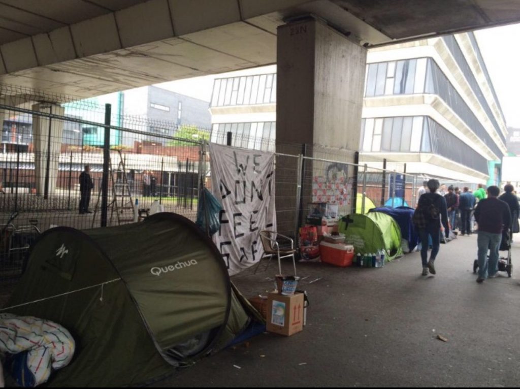 The group moved to the side of the road after being evicted from a bigger site which has now been fenced off