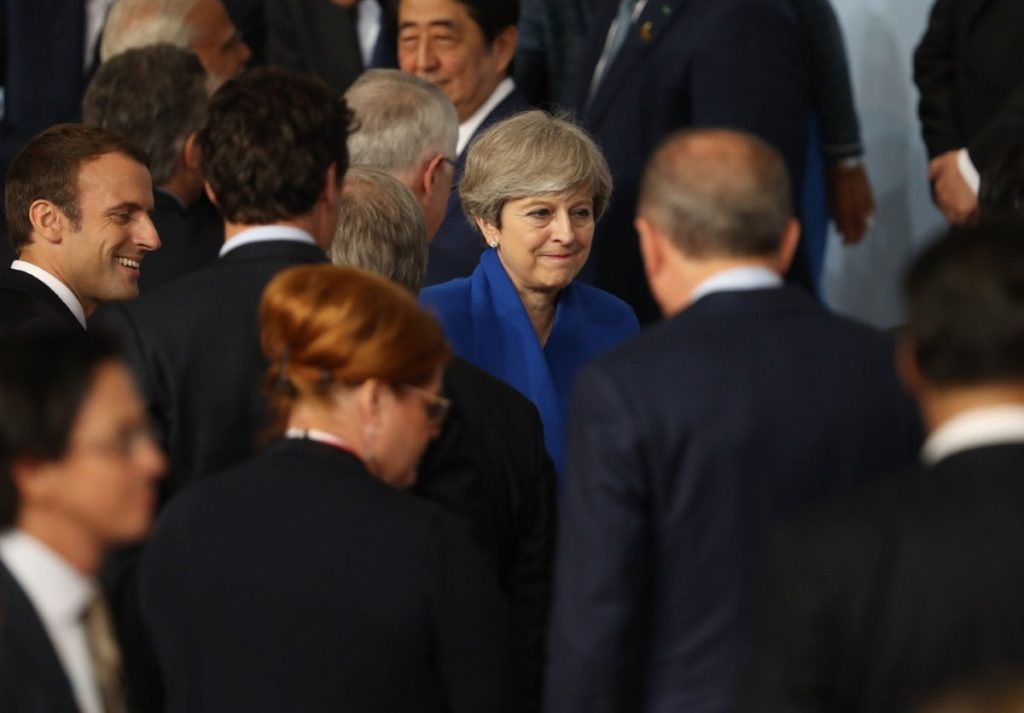 Theresa May cuts a lonely figure at the G20 summit on Friday morning 