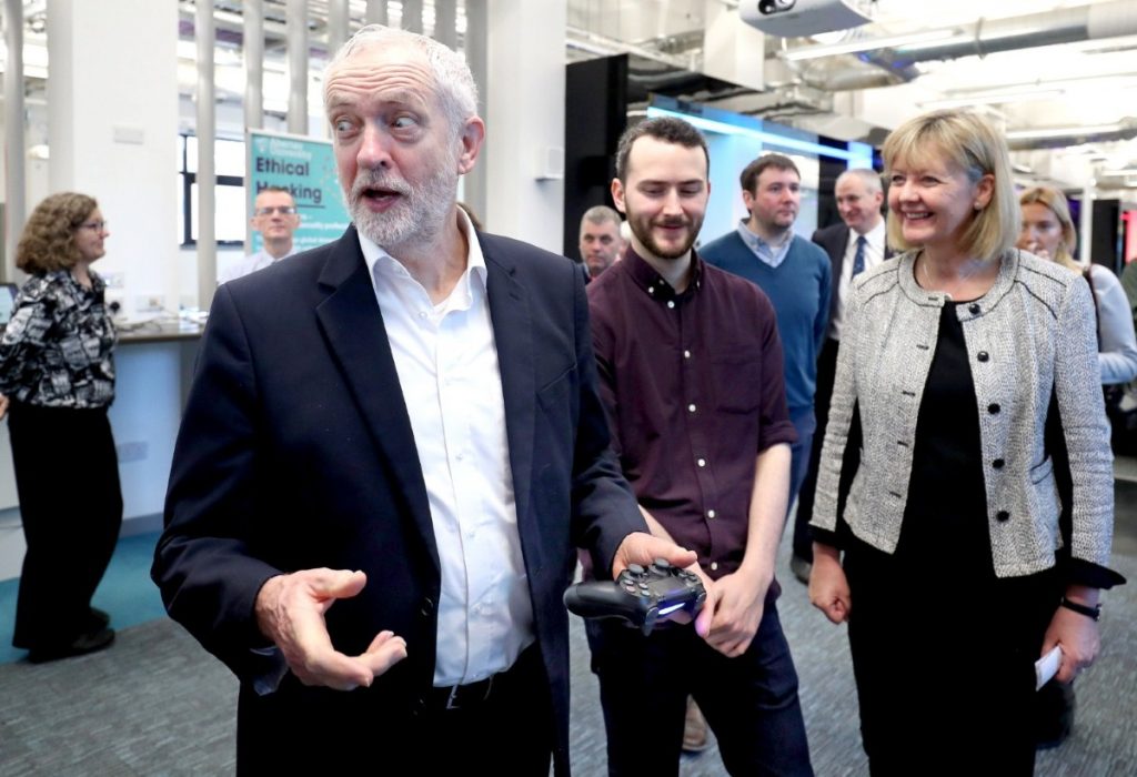 Jeremy Corbyn has a go at a PlayStation game developed by students, during the Scottish Labour conference in Dundee. 