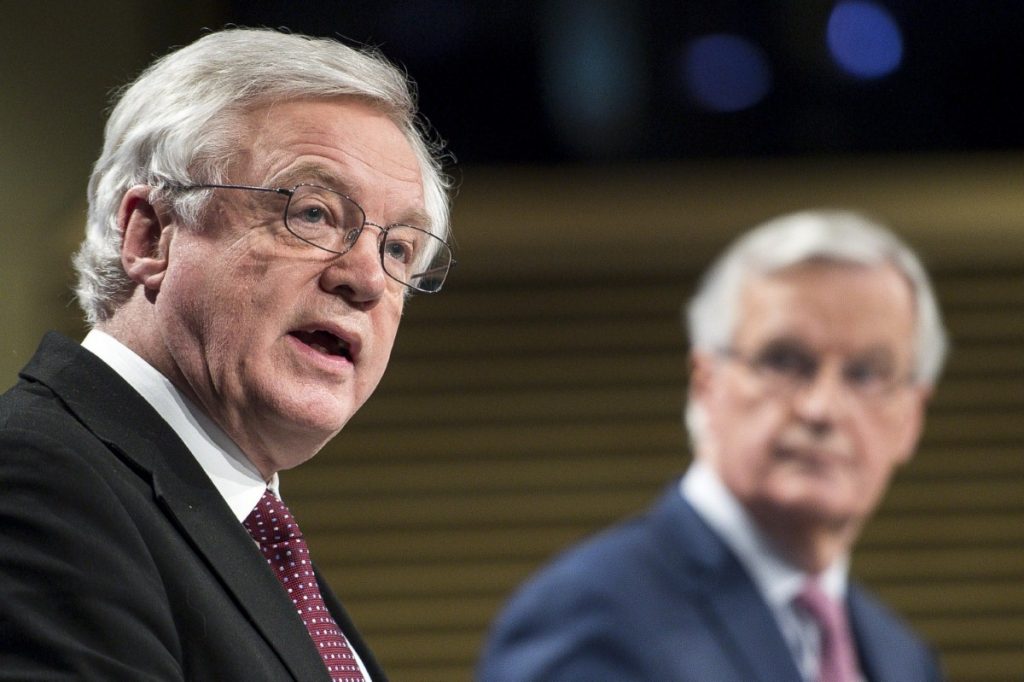 David Davis addresses journalists as Michel Barnier looks on during their press conference today.  