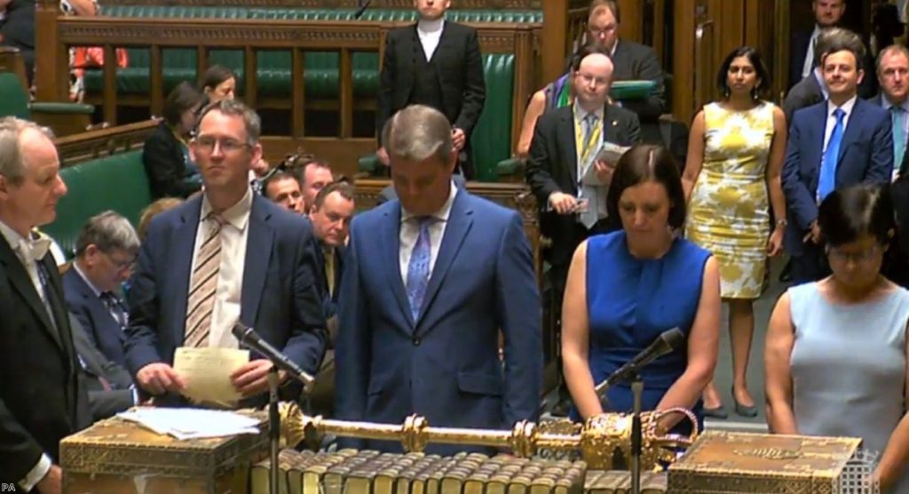 MPs in the House of Commons, London announce the vote in the Government