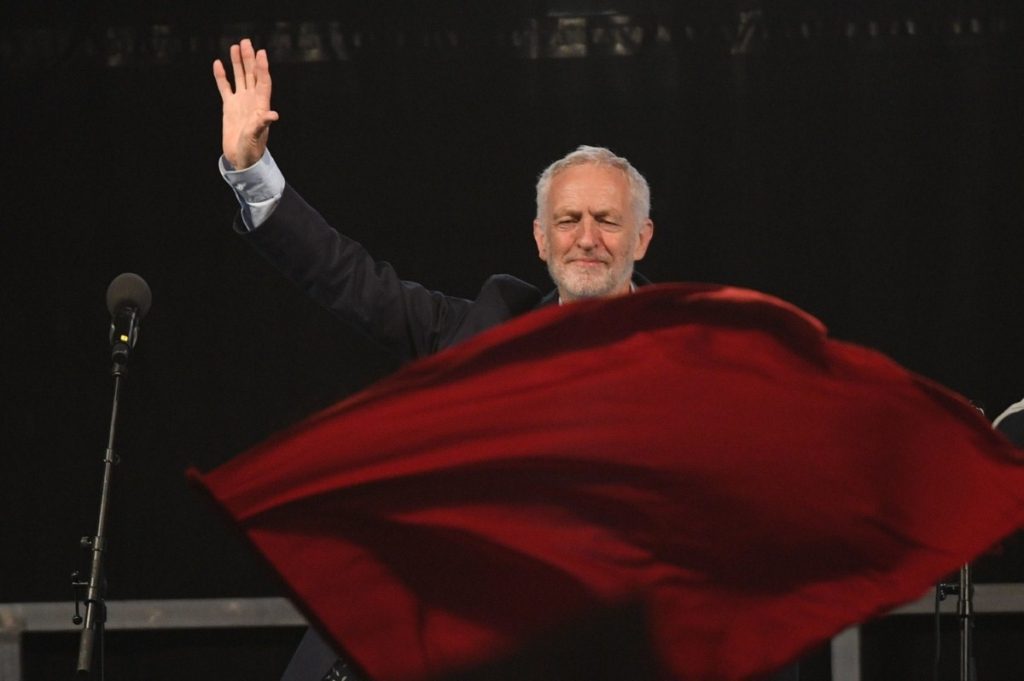 A red flag flies yesterday as Corbyn speaks at a rally at Pier Head in Liverpool, ahead of party conference 