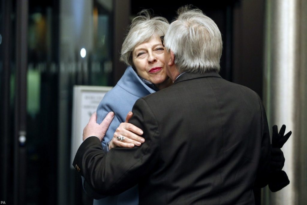 May, background is welcomed by Juncker in Strasbourg yesterday evening 