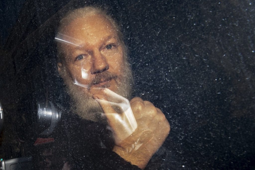 Julian Assange arrives at Westminster Magistrates' Court yesterday.