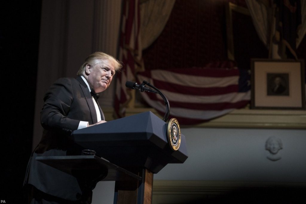 US President Donald Trump delivers a speech at the Ford