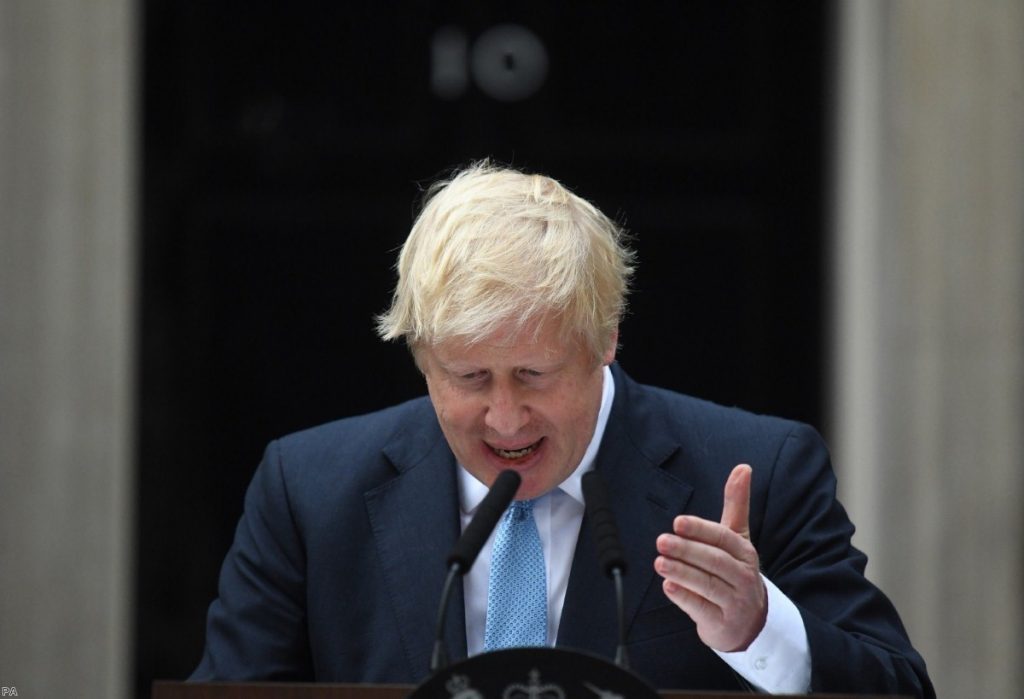 Johnson stands outside No.10 as he made a statement this afternoon  