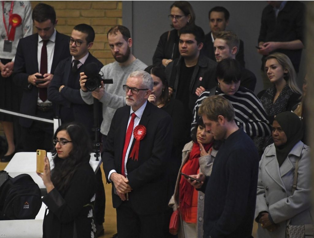 Jeremy Corbyn and his wife Laura Alvarez wait for the declaration of his seat as Labour seats fell across the country. 