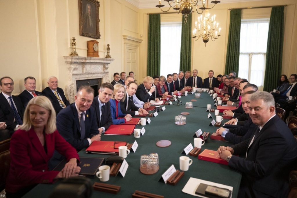 Johnson presides over his new Cabinet on Friday morning. 