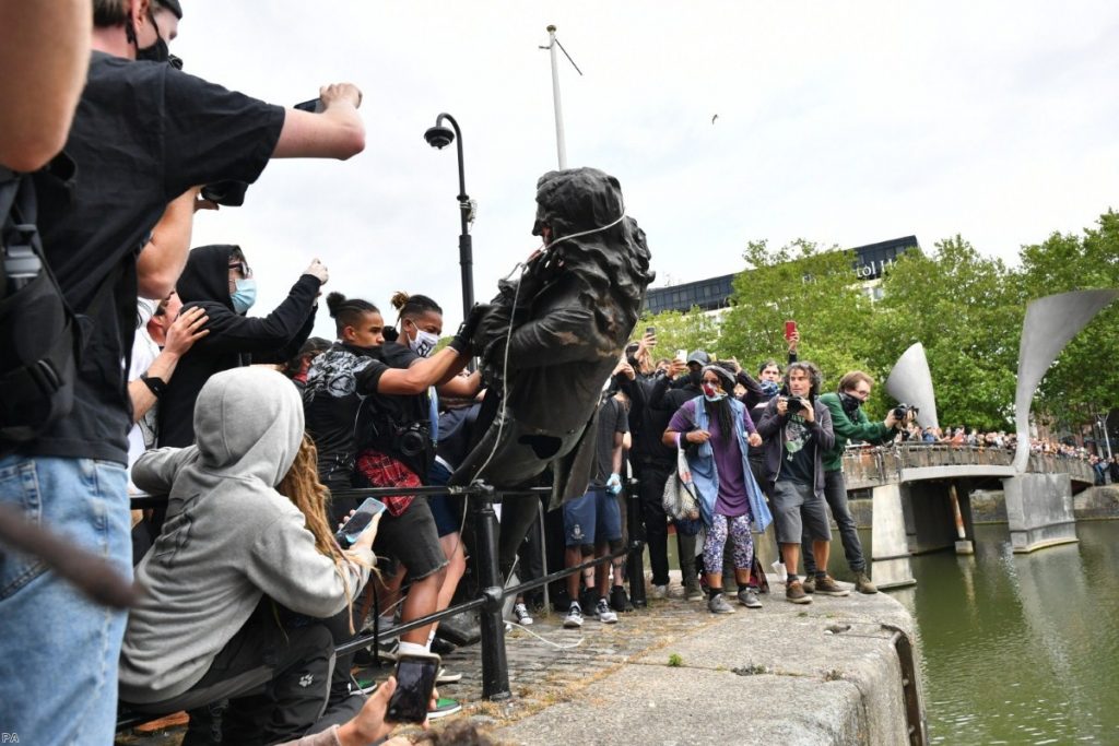 Protesters throw a statue of Edward Colston into Bristol harbour during a Black Lives Matter protest last weekend. 