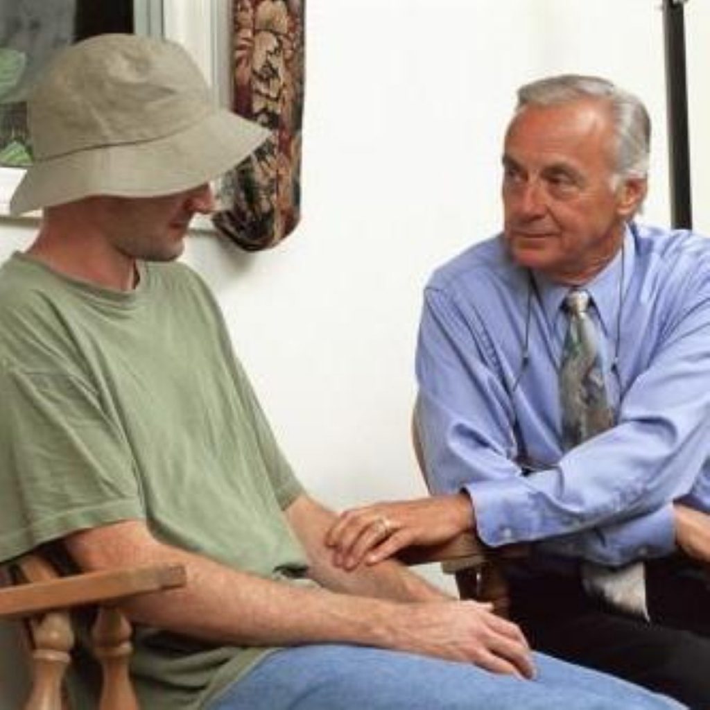 A doctor talks to a young patient