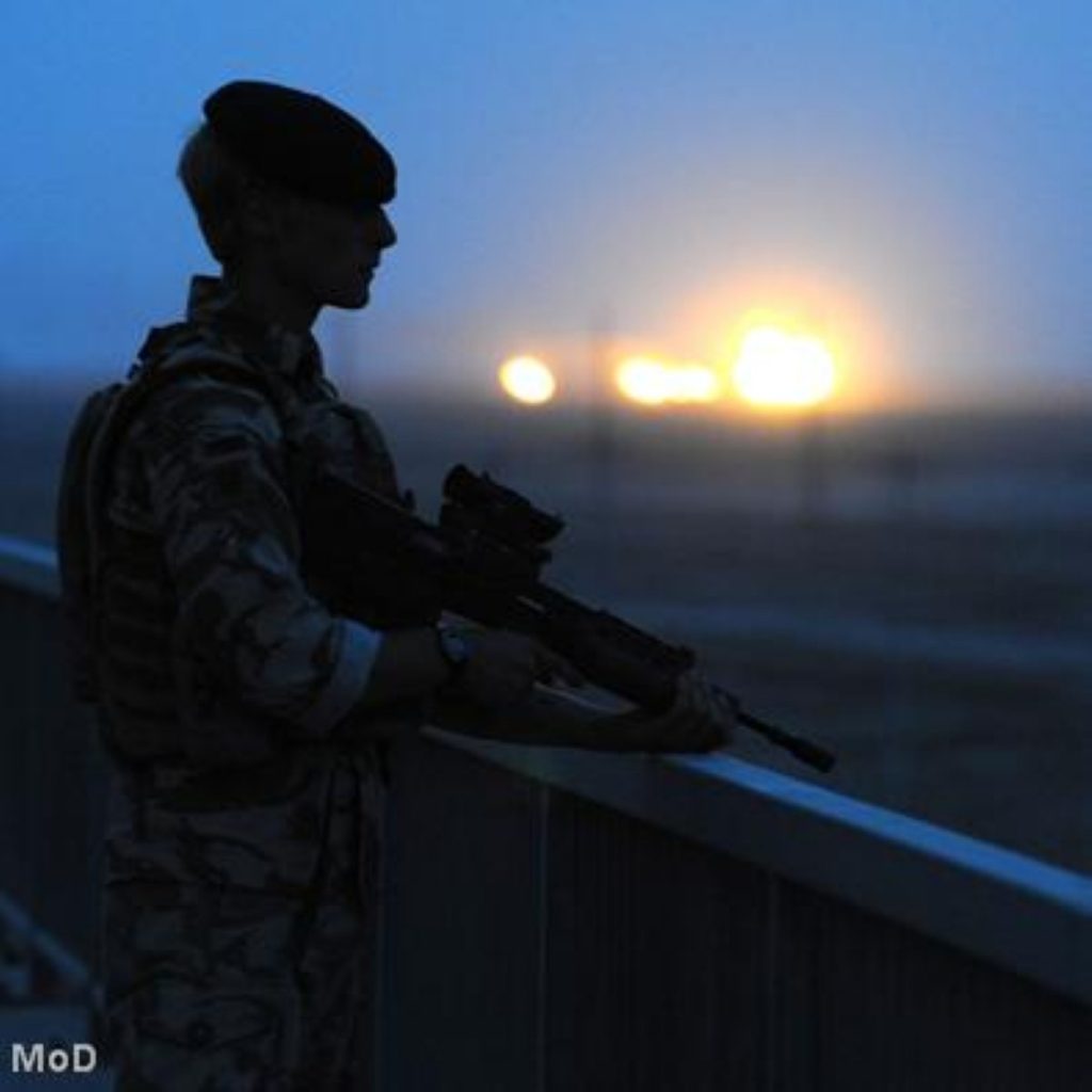 A British troop gazes at the skyline in Iraq. Yesterday