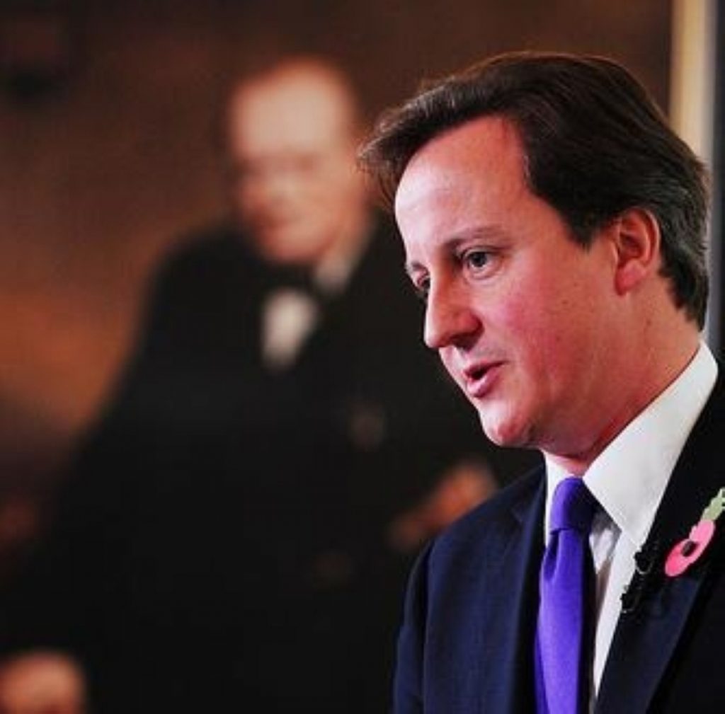 David Cameron delivers his monthly press conference, as Churchill looks on