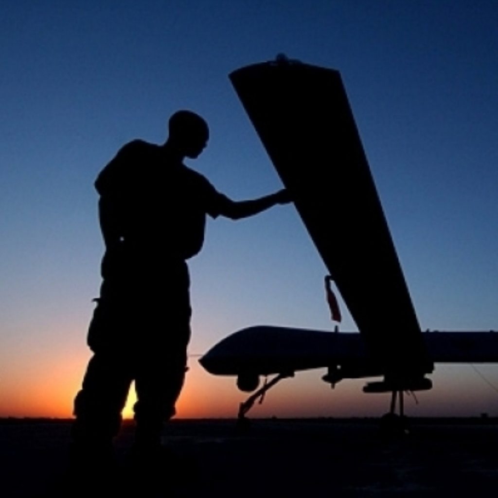 A US serviceman stands by an unmanned drone. the use of the machines has been condemned by human rights groups as an example of extra-judicial assassination.  