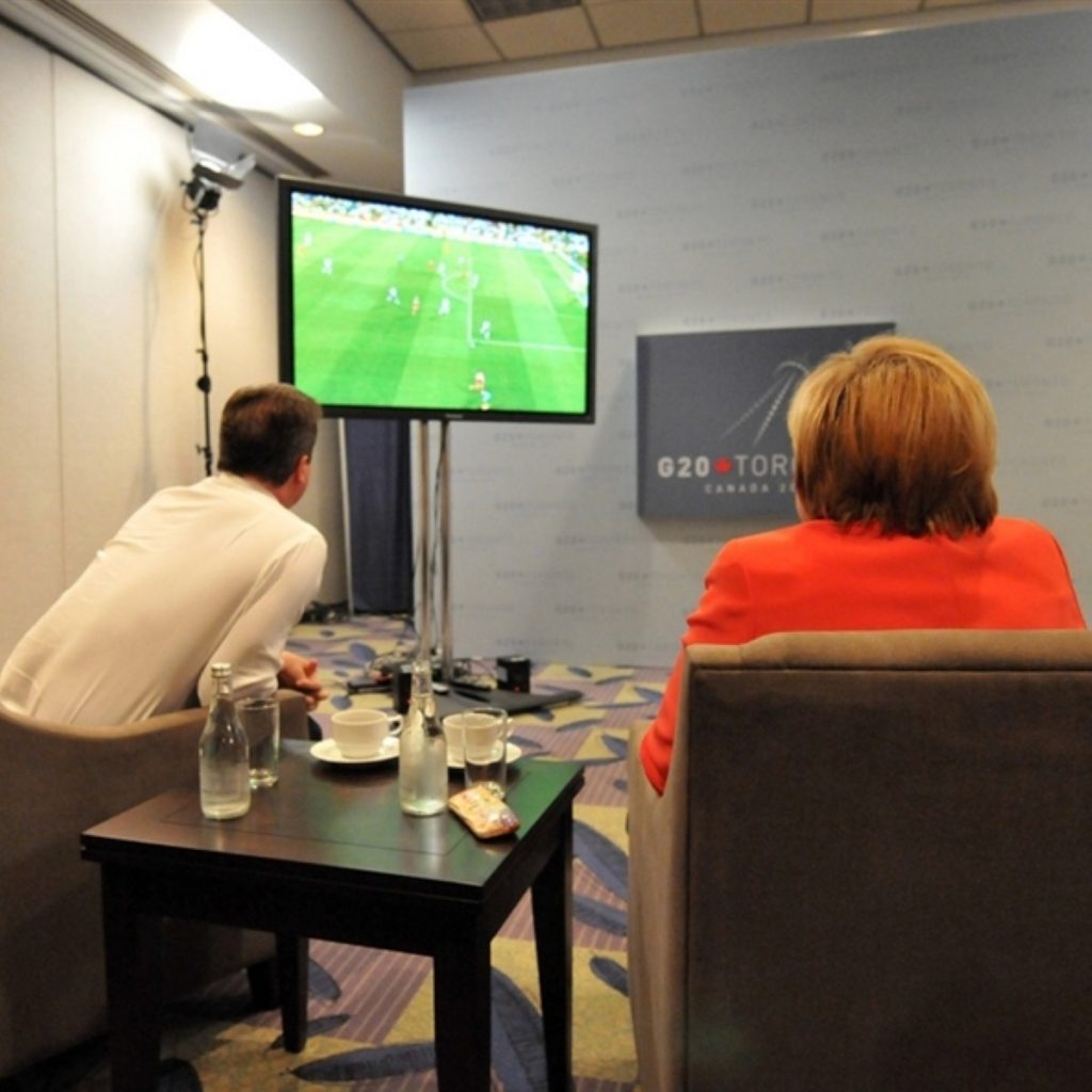 Cameron and Merkel watch England play Germany in the football: The two struck up a friendship over hours of Midsomer Murder 