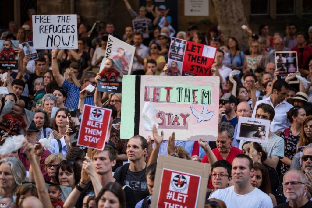 Protests at Sydney Town Hall against the detention of asylum seeker children to the offshore processing centres of Manus Island and Nauru in 2016. 