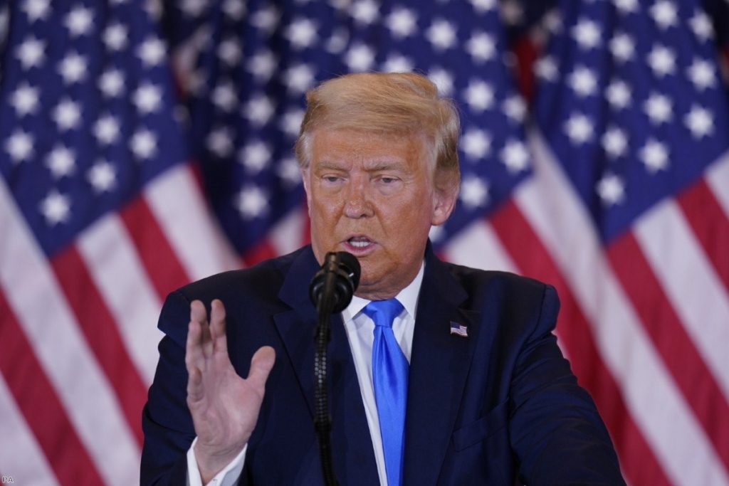 Donald Trump makes a statement to his supporters in the East Room of the White House last night. 