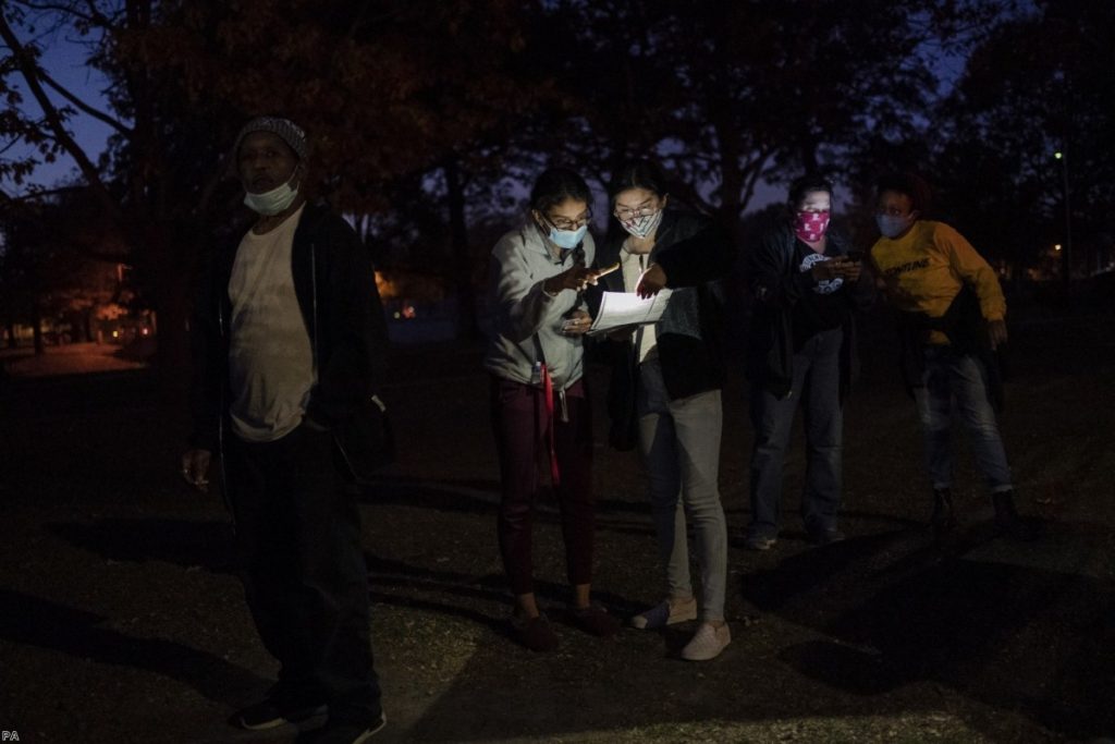 Voters wait in line at a polling centre on election day in Kenosha, Wisconsin. Opinion polls in the weeks ahead of the vote hugely overestimated Biden