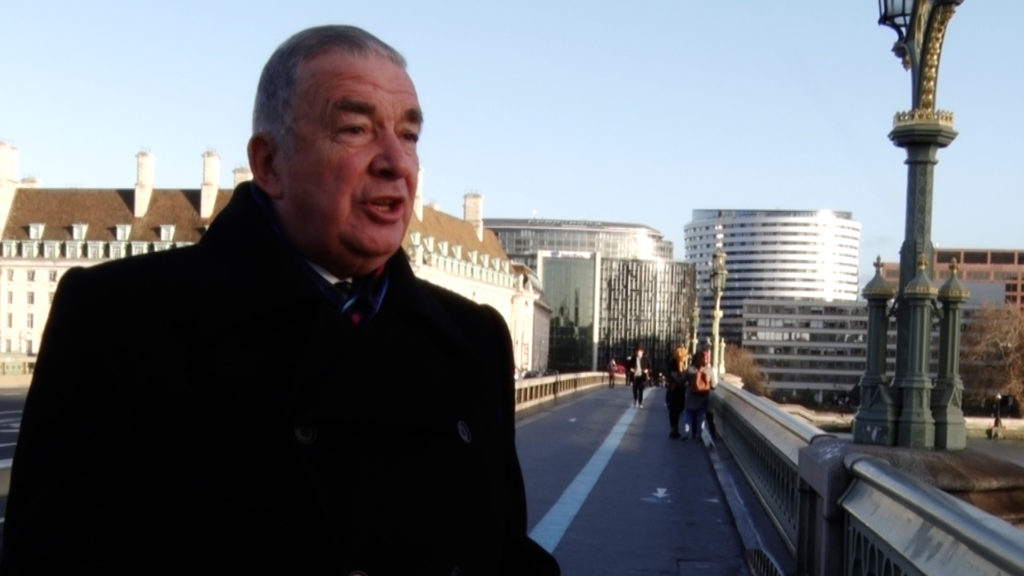 Admiral Lord West standing on London Bridge