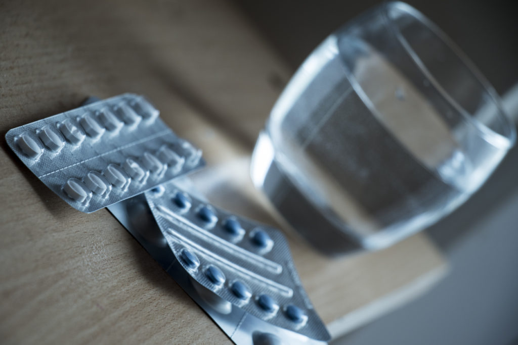 Pill and water glass