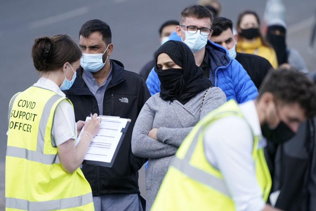 People queuing for Covid vaccinations in Bolton